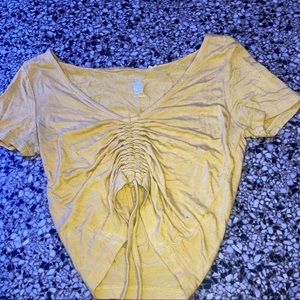 This is a very cute yellow shirt from pacsun